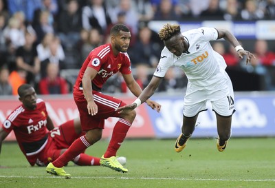 230917 - Swansea City v Watford, Premier League - Tammy Abraham of Swansea City is brought down by Adrian Mariappa of Watford