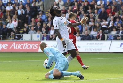 230917 - Swansea City v Watford, Premier League - Wilfried Bony of Swansea City shows his frustration as Watford goalkeeper Heurelho Gomes collects the ball