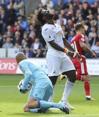 230917 - Swansea City v Watford, Premier League - Wilfried Bony of Swansea City shows his frustration as Watford goalkeeper Heurelho Gomes collects the ball