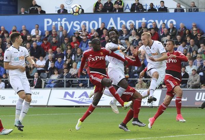 230917 - Swansea City v Watford, Premier League - Wilfried Bony of Swansea City and Mike van der Hoorn of Swansea City look to win the ball in front of goal