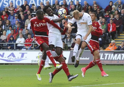 230917 - Swansea City v Watford, Premier League - Wilfried Bony of Swansea City and Mike van der Hoorn of Swansea City look to win the ball in front of goal