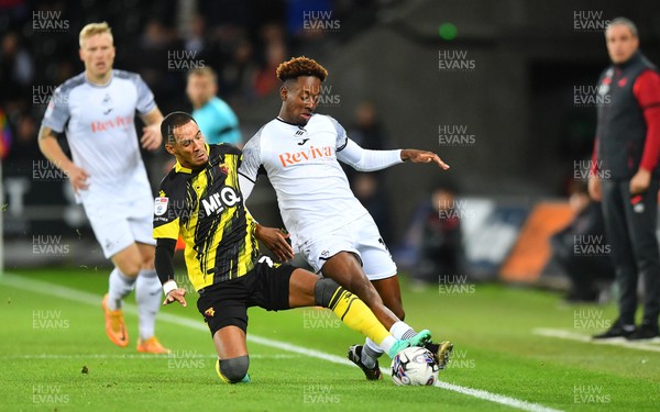 241023 - Swansea City v Watford - EFL SkyBet Championship - Jamal Lowe of Swansea City is tackled by Thomas Ince of Watford