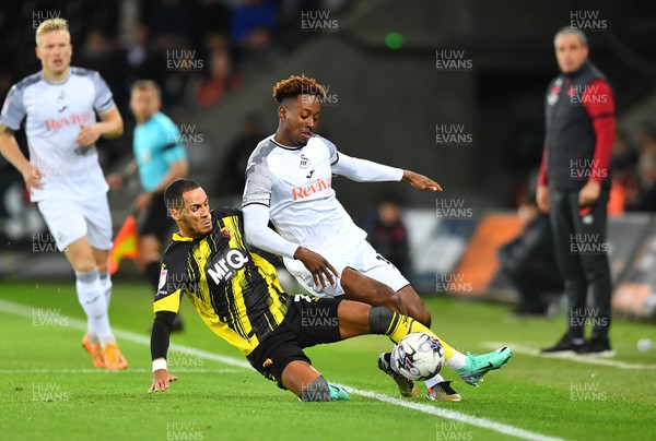 241023 - Swansea City v Watford - EFL SkyBet Championship - Jamal Lowe of Swansea City is tackled by Thomas Ince of Watford