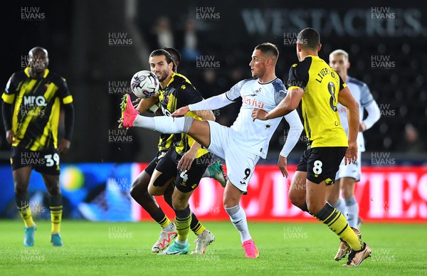 241023 - Swansea City v Watford - EFL SkyBet Championship - Jerry Yates of Swansea City is tackled by Wesley Hoedt of Watford