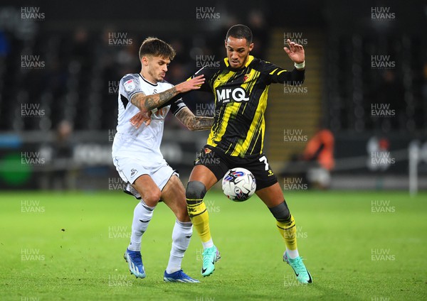 241023 - Swansea City v Watford - EFL SkyBet Championship - Thomas Ince of Watford is tackled by Jamie Paterson of Swansea City