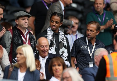 230825 - Swansea City v Watford FC - SkyBet Championship - Snoop Dogg�s son Cordell Broadus watches the game from the stands with Swansea City owner and shareholder Brett Cravatt