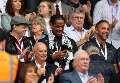 230825 - Swansea City v Watford FC - SkyBet Championship - Snoop Dogg�s son Cordell Broadus watches the game from the stands with Swansea City owner and shareholder Brett Cravatt