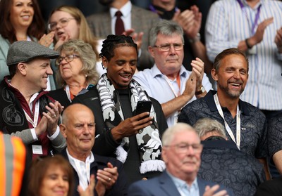 230825 - Swansea City v Watford FC - SkyBet Championship - Snoop Dogg�s son Cordell Broadus watches the game from the stands with Swansea City owner and shareholder Brett Cravatt