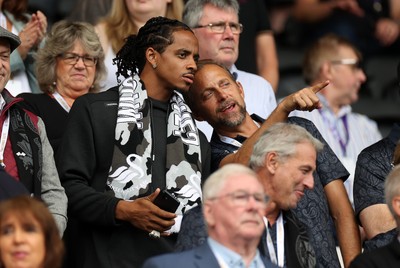 230825 - Swansea City v Watford FC - SkyBet Championship - Snoop Dogg�s son Cordell Broadus watches the game from the stands with Swansea City owner and shareholder Brett Cravatt