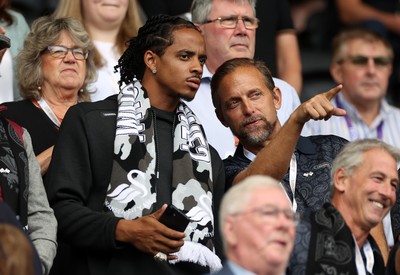 230825 - Swansea City v Watford FC - SkyBet Championship - Snoop Dogg�s son Cordell Broadus watches the game from the stands with Swansea City owner and shareholder Brett Cravatt
