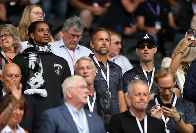 230825 - Swansea City v Watford FC - SkyBet Championship - Snoop Dogg�s son Cordell Broadus watches the game from the stands with Swansea City owner and shareholder Brett Cravatt and Scott Hochstadt