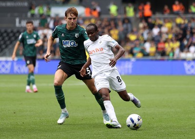 230825 - Swansea City v Watford FC - SkyBet Championship - Malick Yalcouye of Swansea City is challenged by Hector Kyprianou of Watford 