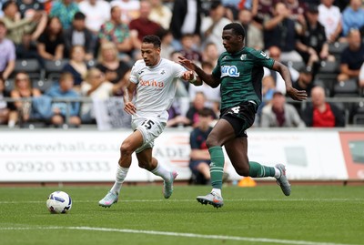 230825 - Swansea City v Watford FC - SkyBet Championship - Ronald of Swansea City is tackled by Kevin Keben of Watford 