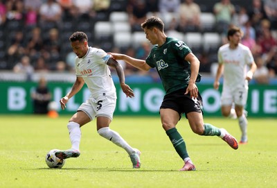 230825 - Swansea City v Watford FC - SkyBet Championship - Ronald of Swansea City is challenged by Luca Kjerrumgaard of Watford 