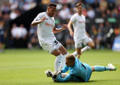 230825 - Swansea City v Watford FC - SkyBet Championship - Ronald of Swansea City collides with keeper Egil Selvik of Watford 