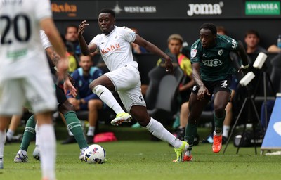 230825 - Swansea City v Watford FC - SkyBet Championship - Zeidane Inoussa of Swansea City is challenged by Jeremy Ngakia of Watford 