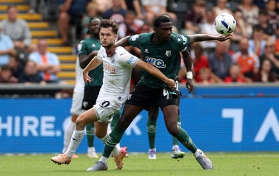 230825 - Swansea City v Watford FC - SkyBet Championship - Liam Cullen of Swansea City is challenged by K�vin Keben of Watford 