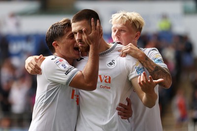 230825 - Swansea City v Watford FC - SkyBet Championship - Zan Vipotnik of Swansea City celebrates scoring a goal with team mates Goncalo Franco and Melker Widell