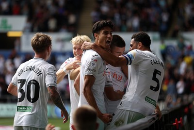 230825 - Swansea City v Watford FC - SkyBet Championship - Zan Vipotnik of Swansea City celebrates scoring a goal with team mates