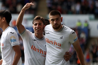 230825 - Swansea City v Watford FC - SkyBet Championship - Zan Vipotnik of Swansea City celebrates scoring a goal with team mate Goncalo Franco