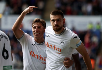 230825 - Swansea City v Watford FC - SkyBet Championship - Zan Vipotnik of Swansea City celebrates scoring a goal with team mate Goncalo Franco