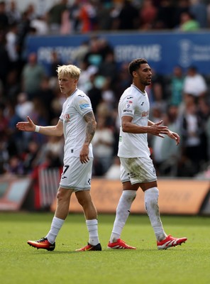 230825 - Swansea City v Watford FC - SkyBet Championship - Melker Widell and Ben Cabango of Swansea City at full time