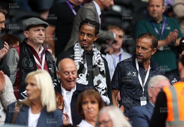 230825 - Swansea City v Watford FC - SkyBet Championship - Snoop Dogg�s son Cordell Broadus watches the game from the stands with Swansea City owner and shareholder Brett Cravatt