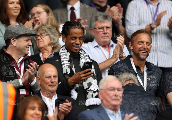 230825 - Swansea City v Watford FC - SkyBet Championship - Snoop Dogg�s son Cordell Broadus watches the game from the stands with Swansea City owner and shareholder Brett Cravatt