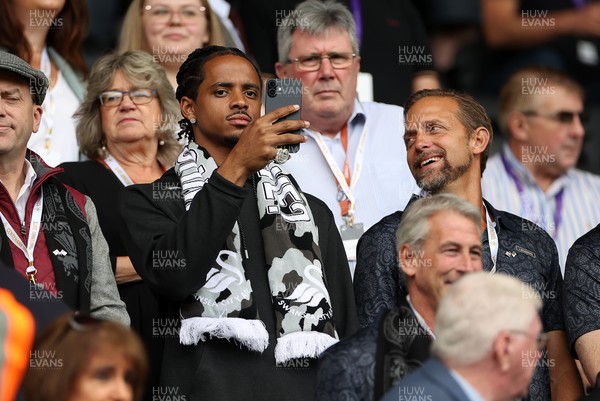 230825 - Swansea City v Watford FC - SkyBet Championship - Snoop Dogg�s son Cordell Broadus watches the game from the stands with Swansea City owner and shareholder Brett Cravatt