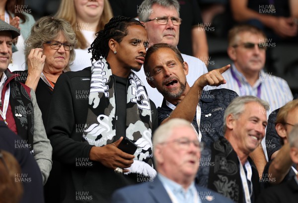 230825 - Swansea City v Watford FC - SkyBet Championship - Snoop Dogg�s son Cordell Broadus watches the game from the stands with Swansea City owner and shareholder Brett Cravatt