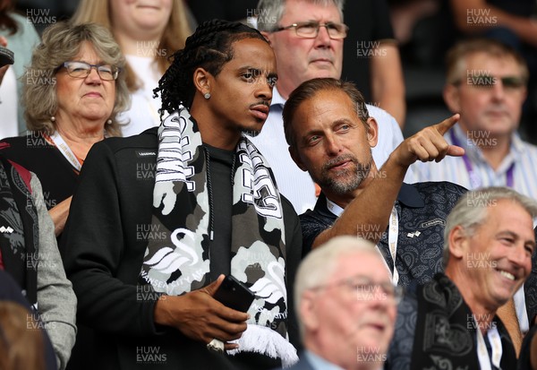 230825 - Swansea City v Watford FC - SkyBet Championship - Snoop Dogg�s son Cordell Broadus watches the game from the stands with Swansea City owner and shareholder Brett Cravatt