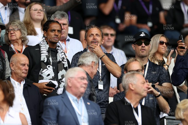230825 - Swansea City v Watford FC - SkyBet Championship - Snoop Dogg�s son Cordell Broadus watches the game from the stands with Swansea City owner and shareholder Brett Cravatt and Scott Hochstadt