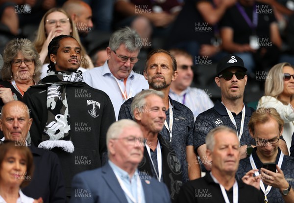 230825 - Swansea City v Watford FC - SkyBet Championship - Snoop Dogg�s son Cordell Broadus watches the game from the stands with Swansea City owner and shareholder Brett Cravatt and Scott Hochstadt