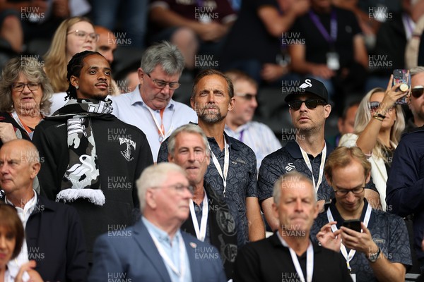 230825 - Swansea City v Watford FC - SkyBet Championship - Snoop Dogg�s son Cordell Broadus watches the game from the stands with Swansea City owner and shareholder Brett Cravatt and Scott Hochstadt