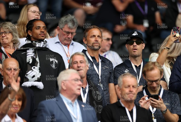 230825 - Swansea City v Watford FC - SkyBet Championship - Snoop Dogg�s son Cordell Broadus watches the game from the stands with Swansea City owner and shareholder Brett Cravatt and Scott Hochstadt
