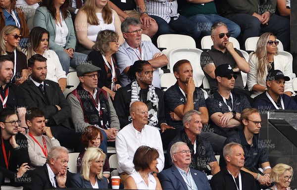 230825 - Swansea City v Watford FC - SkyBet Championship - Snoop Dogg�s son Cordell Broadus watches the game from the stands with Swansea City owner and shareholder Brett Cravatt and Scott Hochstadt