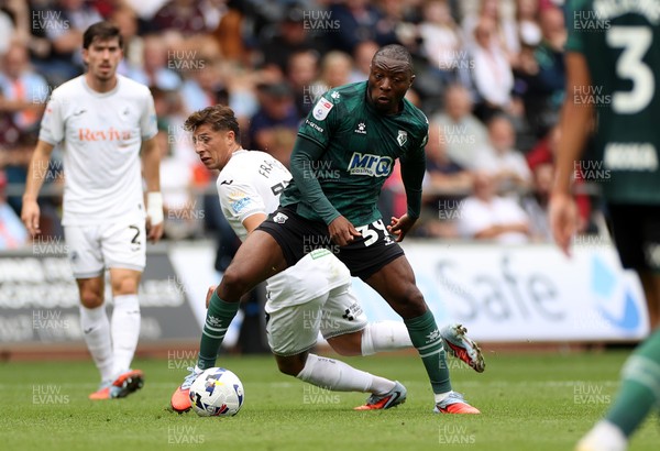 230825 - Swansea City v Watford FC - SkyBet Championship - Edo Kayembe of Watford is challenged by Goncalo Franco of Swansea City 