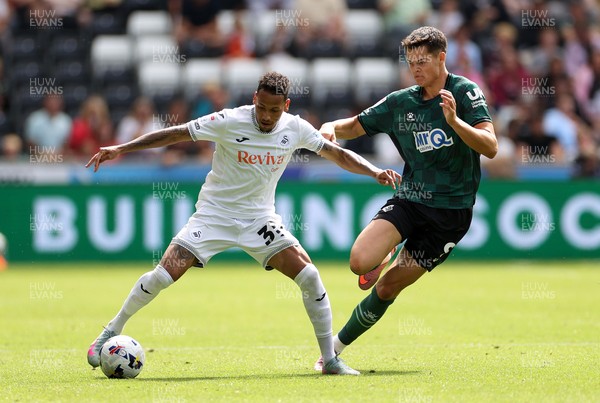 230825 - Swansea City v Watford FC - SkyBet Championship - Ronald of Swansea City is challenged by Luca Kjerrumgaard of Watford 