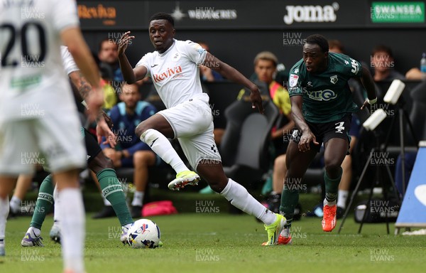 230825 - Swansea City v Watford FC - SkyBet Championship - Zeidane Inoussa of Swansea City is challenged by Jeremy Ngakia of Watford 