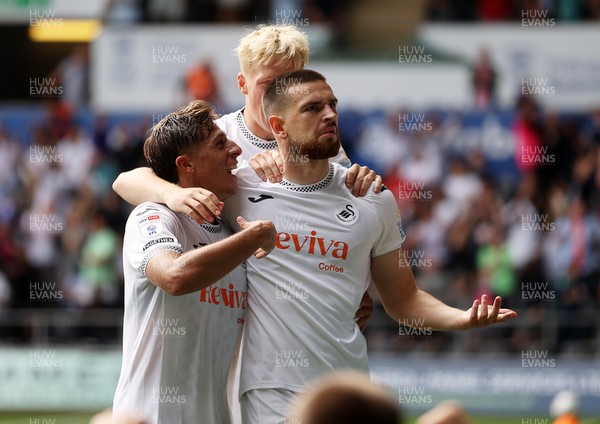 230825 - Swansea City v Watford FC - SkyBet Championship - Zan Vipotnik of Swansea City celebrates scoring a goal with team mates Goncalo Franco and Melker Widell