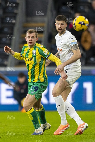 010126 - Swansea City v West Bromwich Albion - Sky Bet Championship - Cameron Burgess of Swansea City in action against Aune Heggebø of West Brom