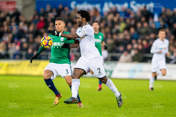 091217 - Swansea City v West Bromwich Albion, Premier League - Wilfried Bony of Swansea City chases the ball past Kieran Gibbs of West Bromwich Albion 