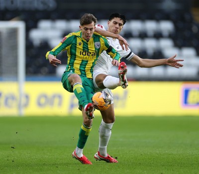 110126 - Swansea City v West Bromwich Albion - FA Cup Third Round - Isaac Price of West Brom is tackled by Marko Stamenic of Swansea City 