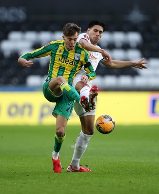110126 - Swansea City v West Bromwich Albion - FA Cup Third Round - Isaac Price of West Brom is tackled by Marko Stamenic of Swansea City 