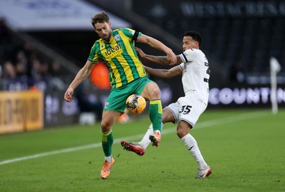 110126 - Swansea City v West Bromwich Albion - FA Cup Third Round - Charlie Taylor of West Brom is tackled by Ronald of Swansea City 