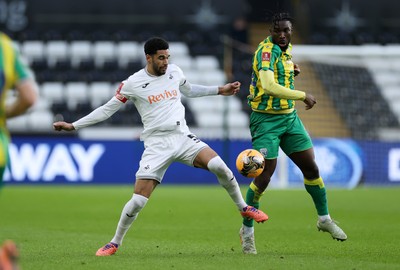 110126 - Swansea City v West Bromwich Albion - FA Cup Third Round - Daryl Dike of West Brom and Ben Cabango of Swansea City go for the ball
