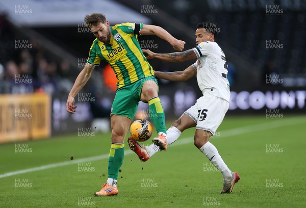 110126 - Swansea City v West Bromwich Albion - FA Cup Third Round - Charlie Taylor of West Brom is tackled by Ronald of Swansea City 
