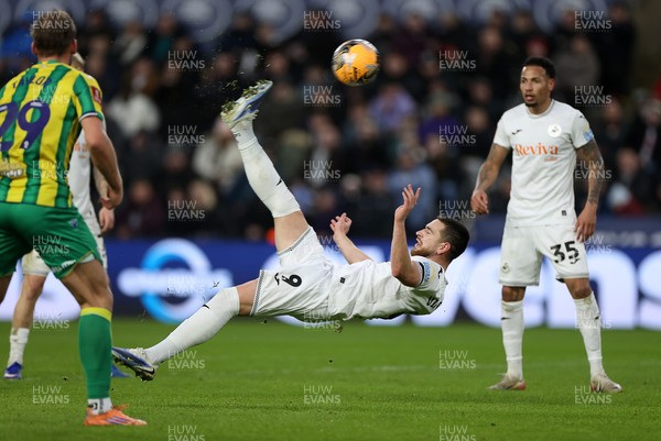 110126 - Swansea City v West Bromwich Albion - FA Cup Third Round - Zan Vipotnik of Swansea City attempts an over head kick