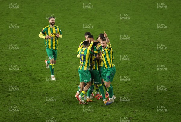 110126 - Swansea City v West Bromwich Albion - FA Cup Third Round - Ollie Bostock of West Brom celebrates with team mates after winning the game on penalties