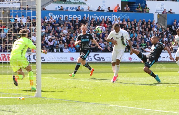 210517 - Swansea City v West Bromwich Albion, Premier League - Jordan Ayew of Swansea City heads to score goal